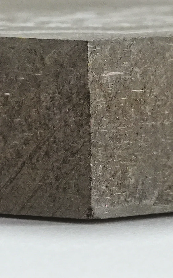 Edge of a dark HDF board.